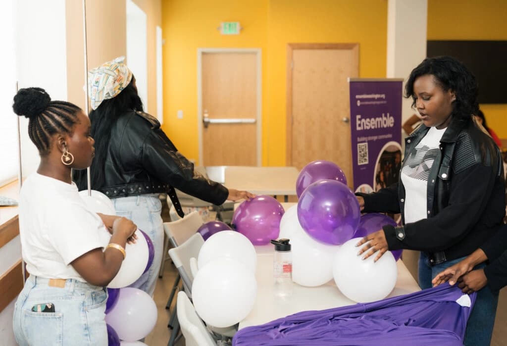 Volunteers preparing decorations at an Ensemble Washington program
