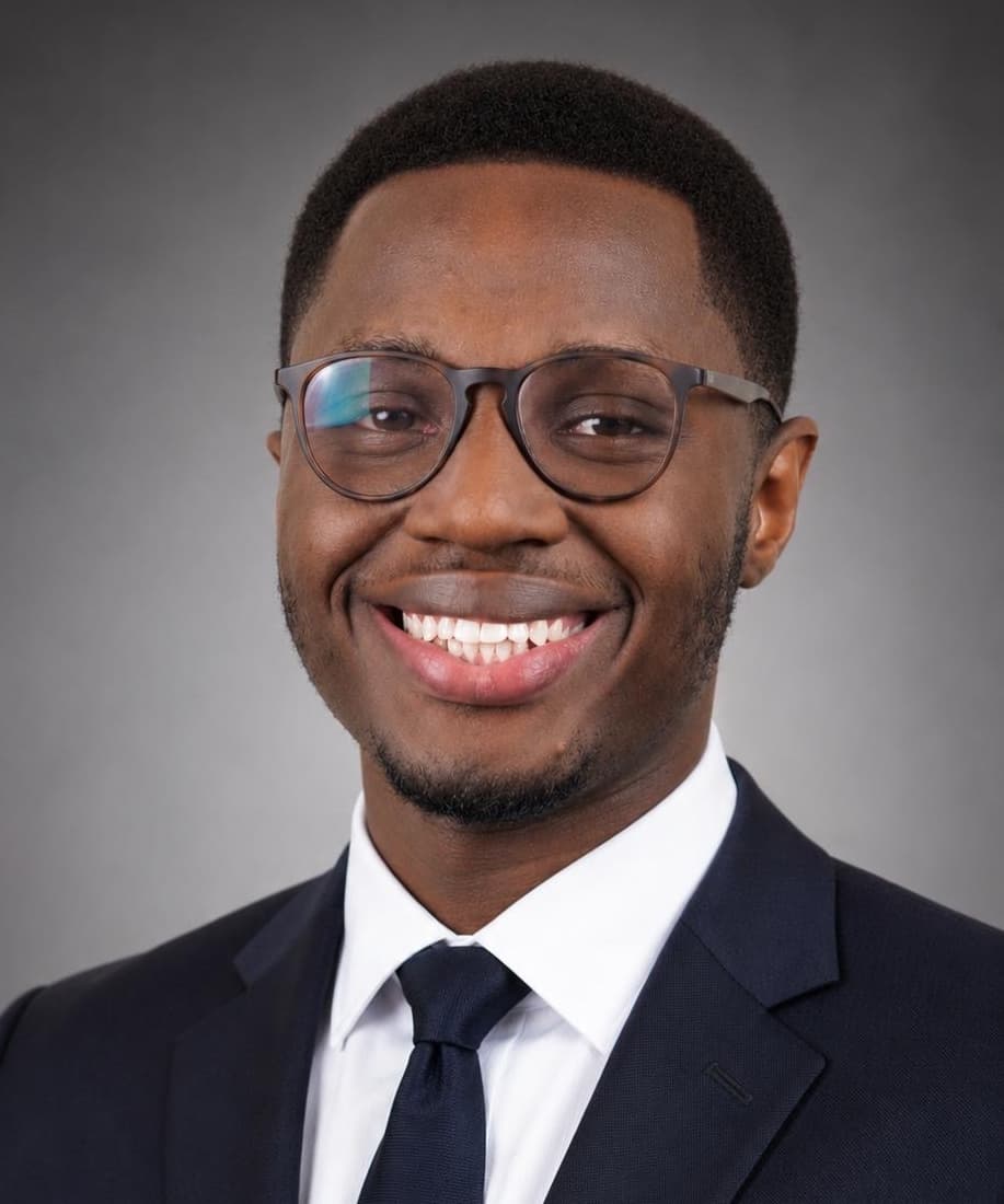 Portrait of Arbogaste Steven in a navy suit and tie